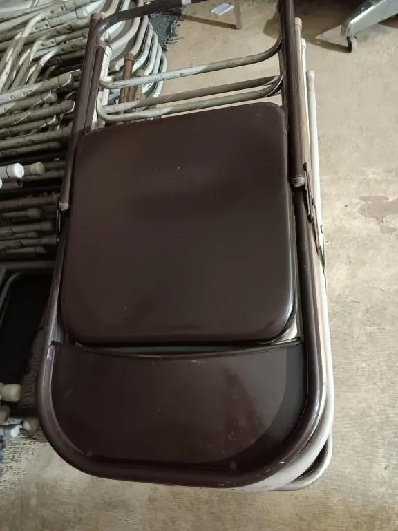 Ten metal folding chairs