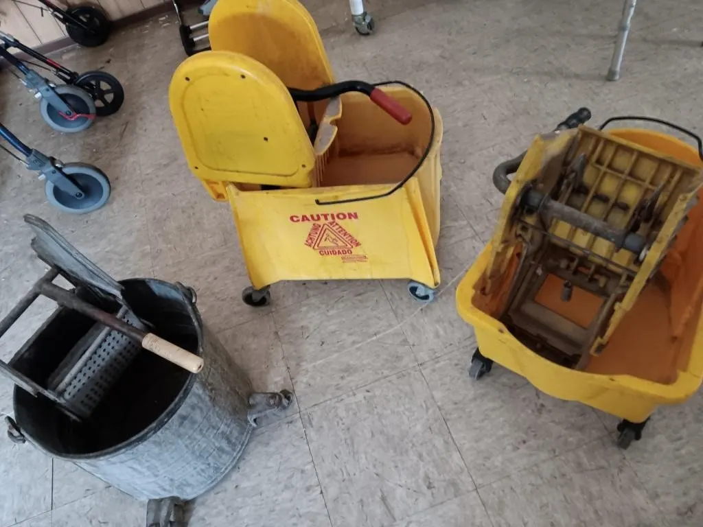 Three mop buckets, two plastic & one metal