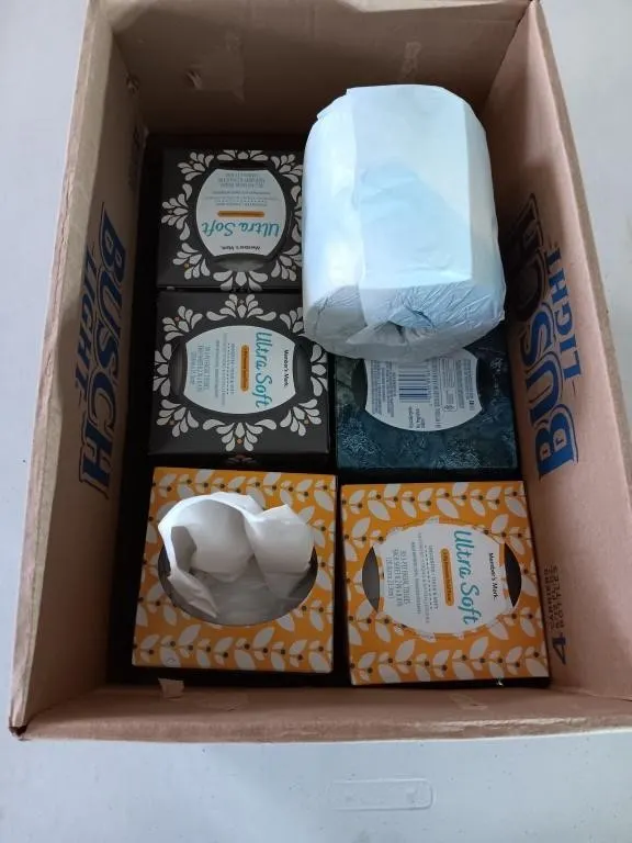 Box of tissue paper. All unopened except for one.