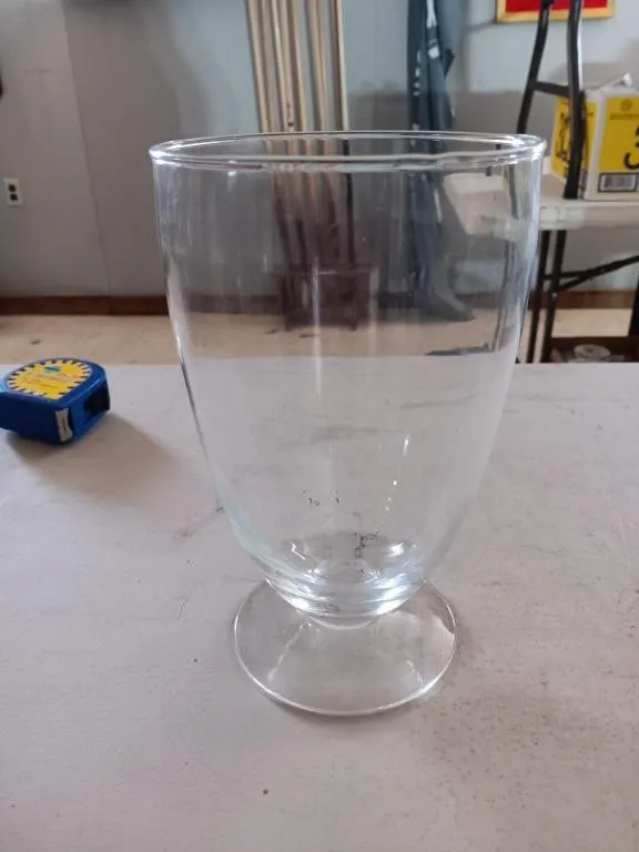 Glass vase 9in. Tall x 5in. diameter. Cool