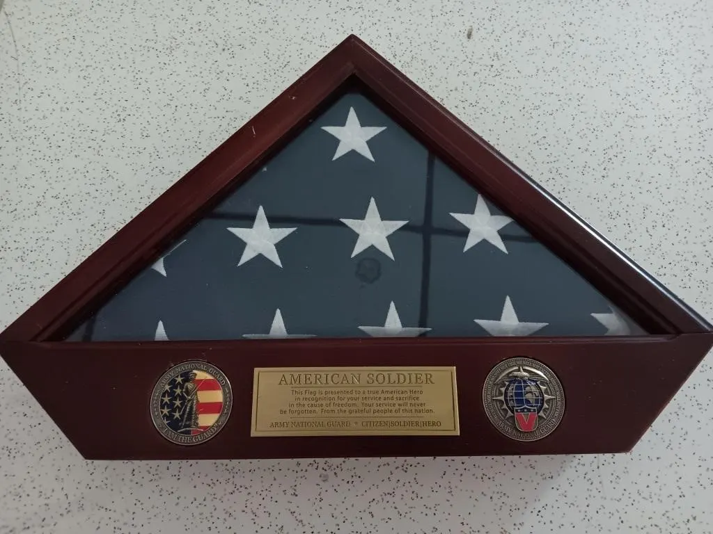 American Soldier Flag in display case.
Army