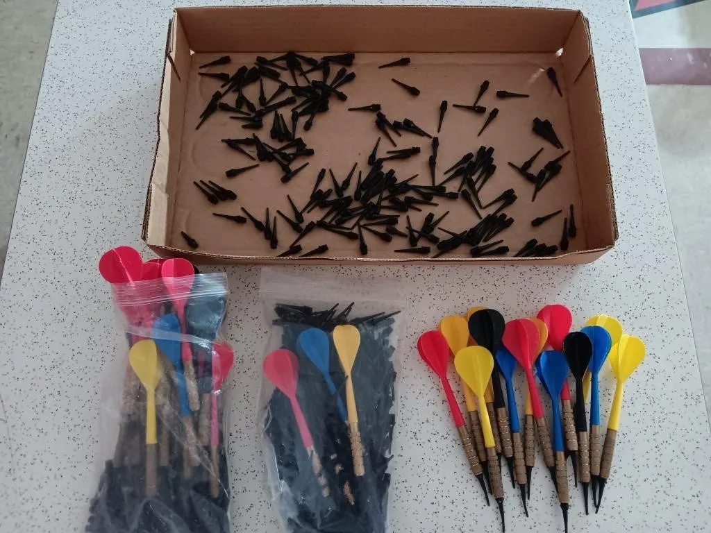 Assortment of plastic tip darts with extra tips.