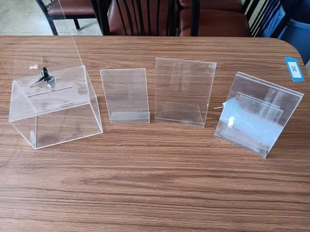 Six total acrylic frames and an acrylic lockbox
