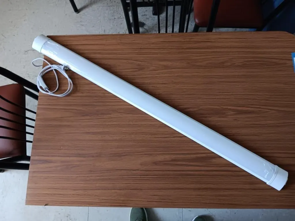 Two plug in shop lights. One measures: 47in. x