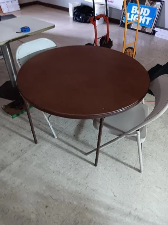 Folding table 42in. Diameter, 27in. tall.