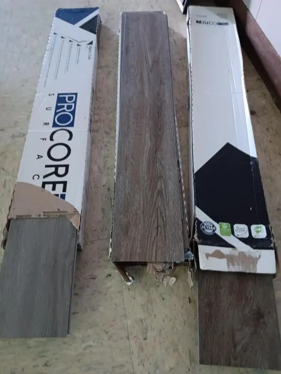 Three boxes of flooring, one box of Legacy Oak &