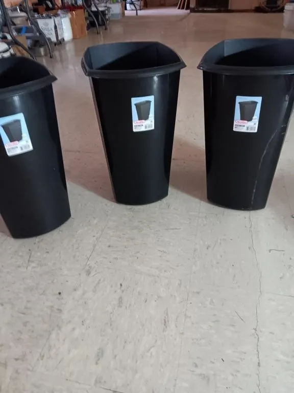 Three 10 gal black trash cans