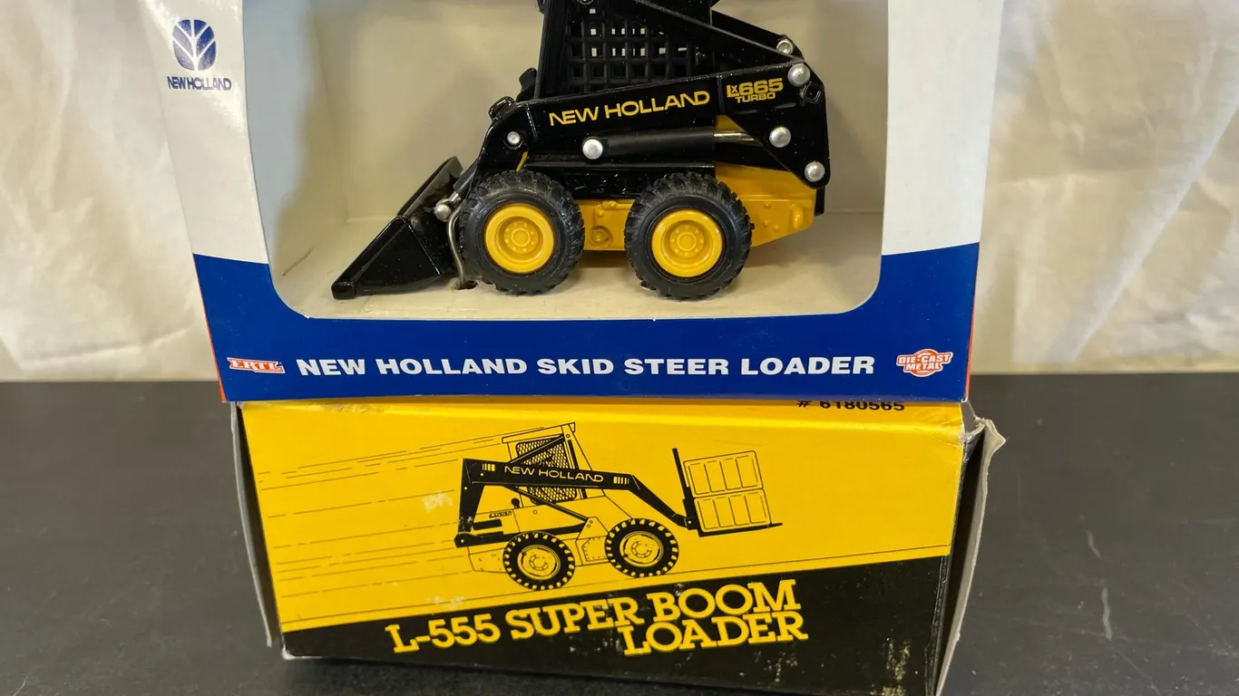 (2) New Holland Skid Steer Loaders