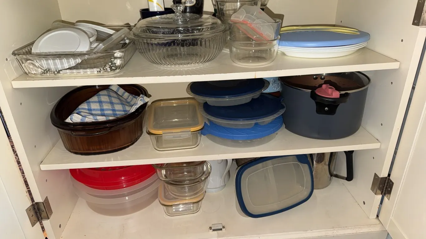 Contents of Cupboard Including Glass Cookware, Stoneware and Glass Teapots, Storage Containers