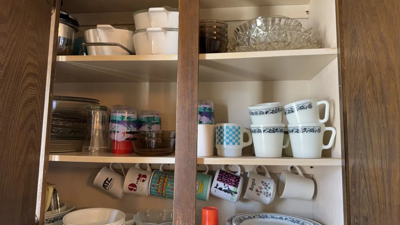 Contents of Cupboard Including Pyrex, Corelle, and Glassware