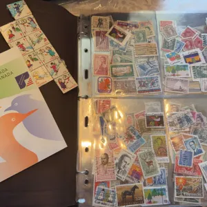 Worldwide Postage Stamp Album with Canadian and International Stamps