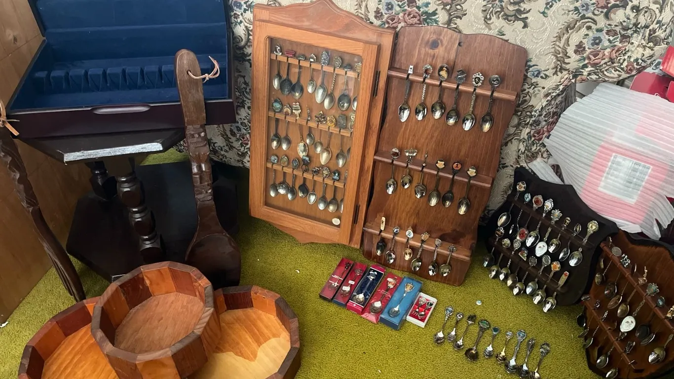 Souvenir Spoons With Racks, Wooden Bowls, and Table