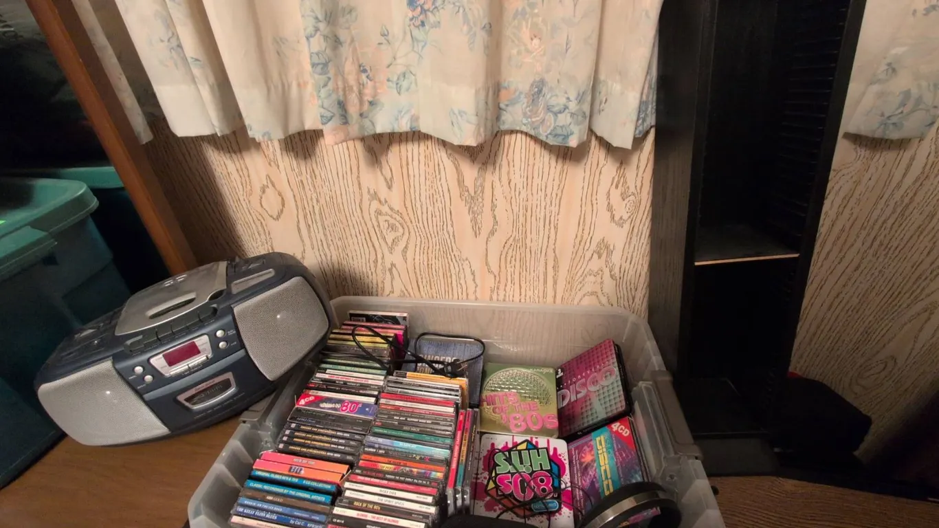 CD Music Collection with CD Player, Cassette Deck, and Storage Rack