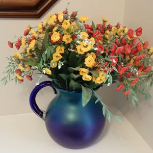 Art Glass Pitcher With Floral Arrangement