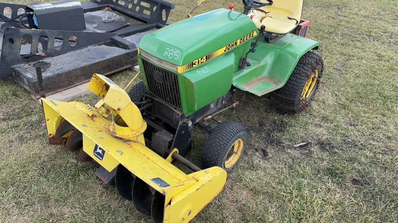 John Deere 314 Tractor, sn 100610, snowblower on front, snow chains on back tires, *Unreserved*