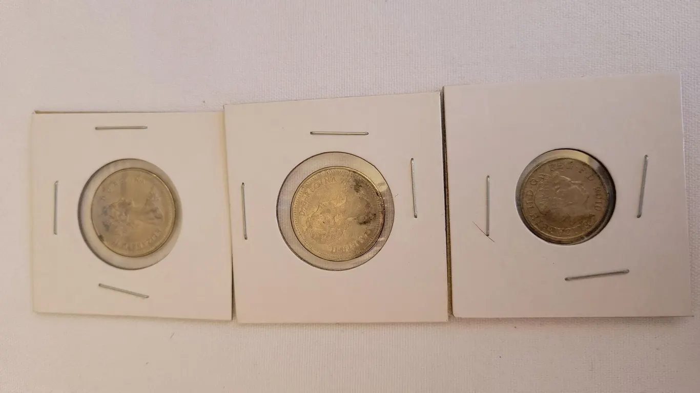 (2) CANADIAN NICKELS AND (1) FIVE PENCE COIN