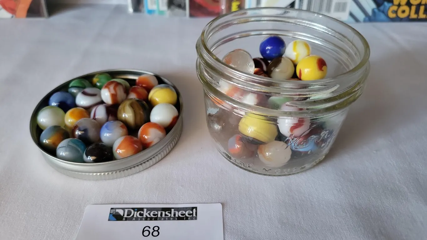 MARBLES IN SMALL JAR AND PHOTOGRAPHED ALSO IN LID