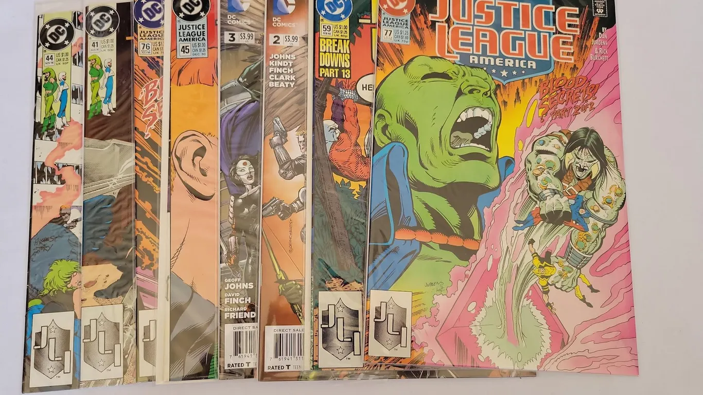 (8) DC JUSTICE LEAGUE AMERICA COMIC BOOKS