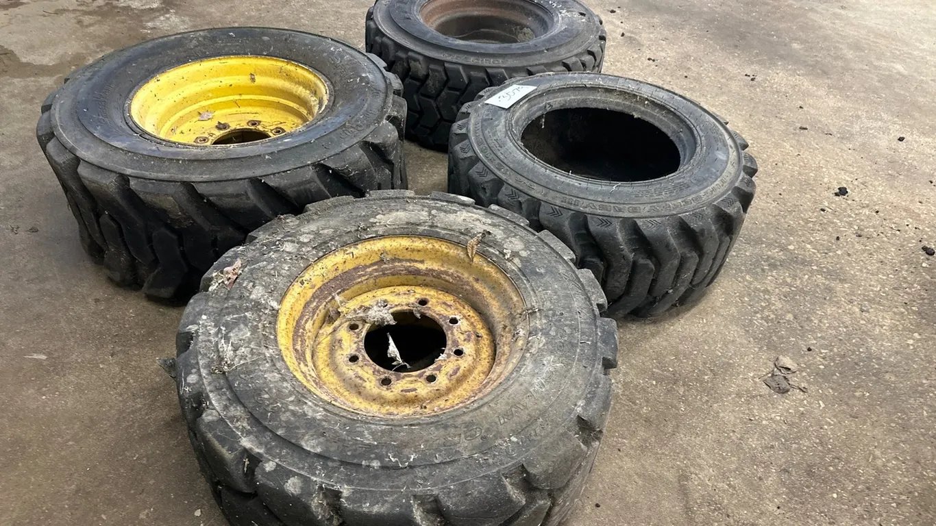 (3) Skid Steer Tires W/ Rims, (1) Skid Steer Tires