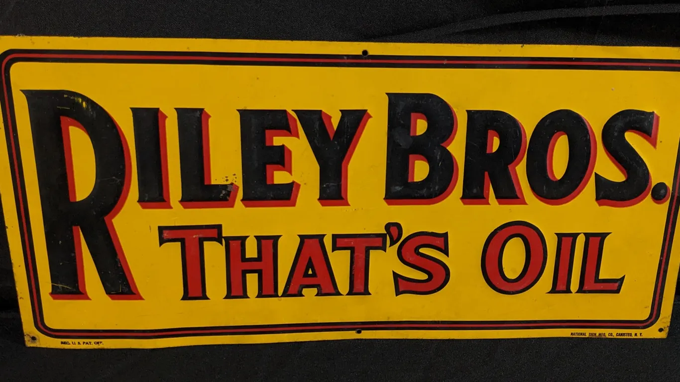 EMBOSSED TIN SIGN RILEY BROS THAT'S OIL