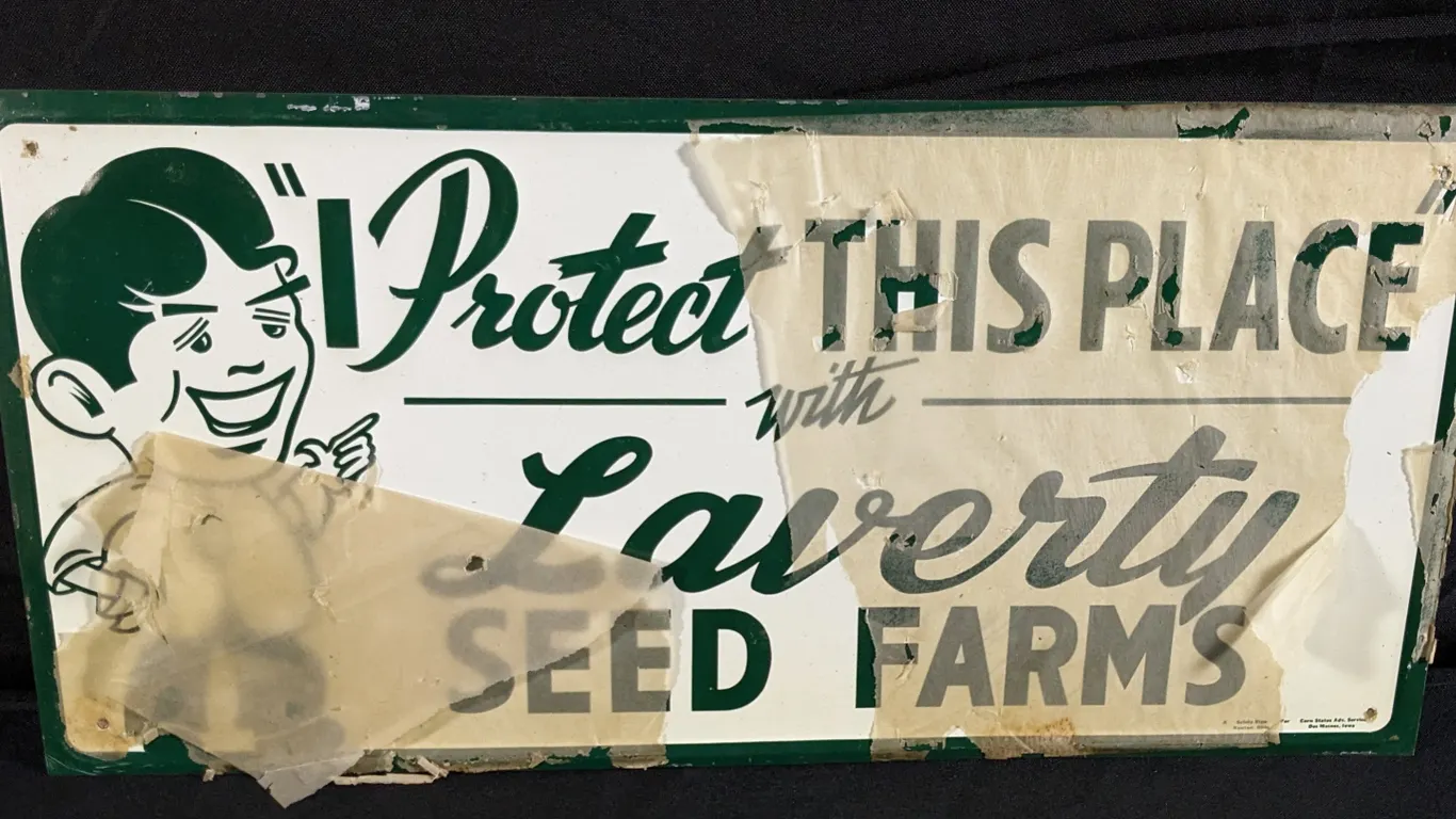 EMBOSSED TIN SIGN I PROTECT THIS PLACE WITH LAVERTY SEED FARMS