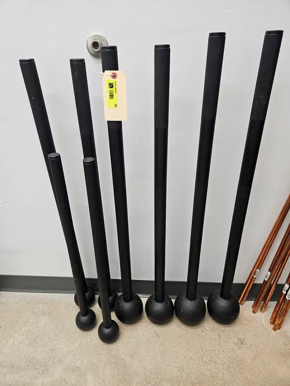 8 Rogue Macebells, 2 - 25 lb., 2 - 20 lb., 2 - 10 lb., 2 - 7 lb.