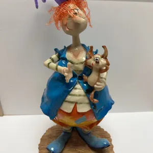Colorful Ceramic Figurine with Purple Hat and Animal Companion