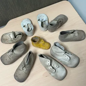 Eight Leather and Plaster Baby Shoes