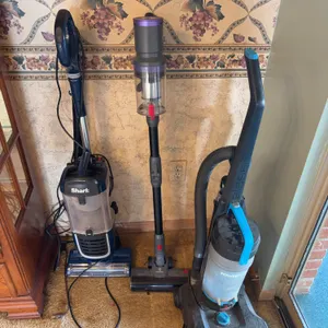 Three Vacuum Cleaners