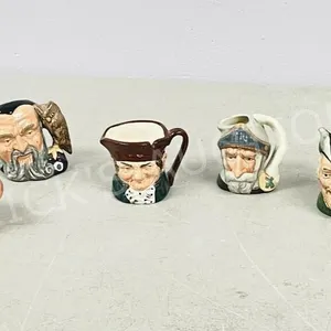 Royal Doulton 5 small jugs 2" tall