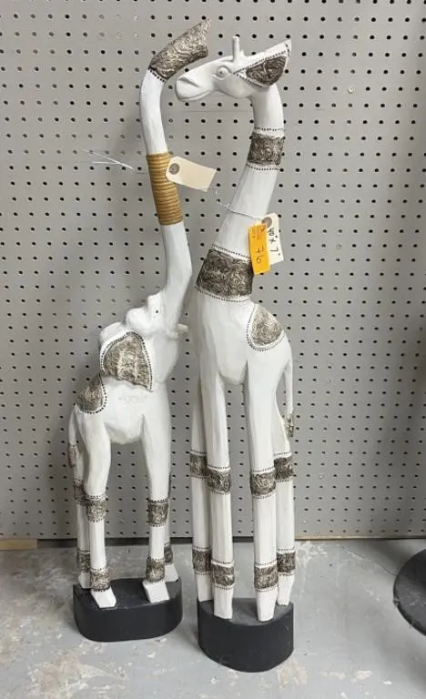 Hand-carved, white-painted wooden animal statues