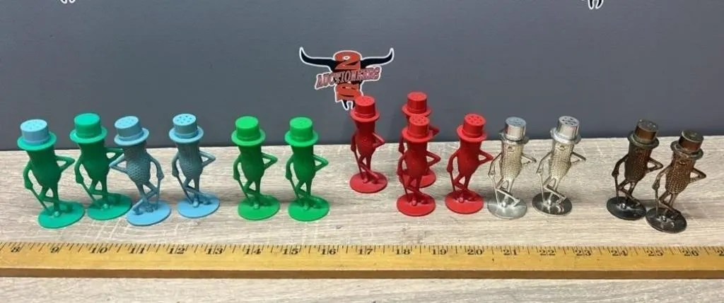 14 Plastic Mr. Peanut Shakers.