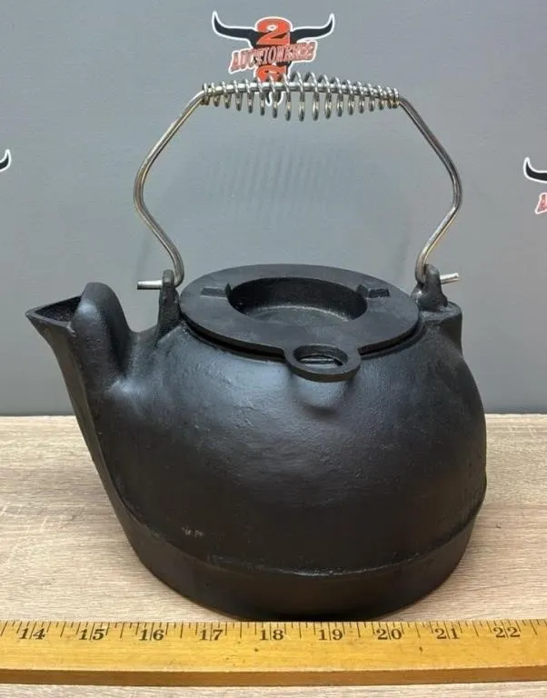 Unmarked Cast Iron Kettle.