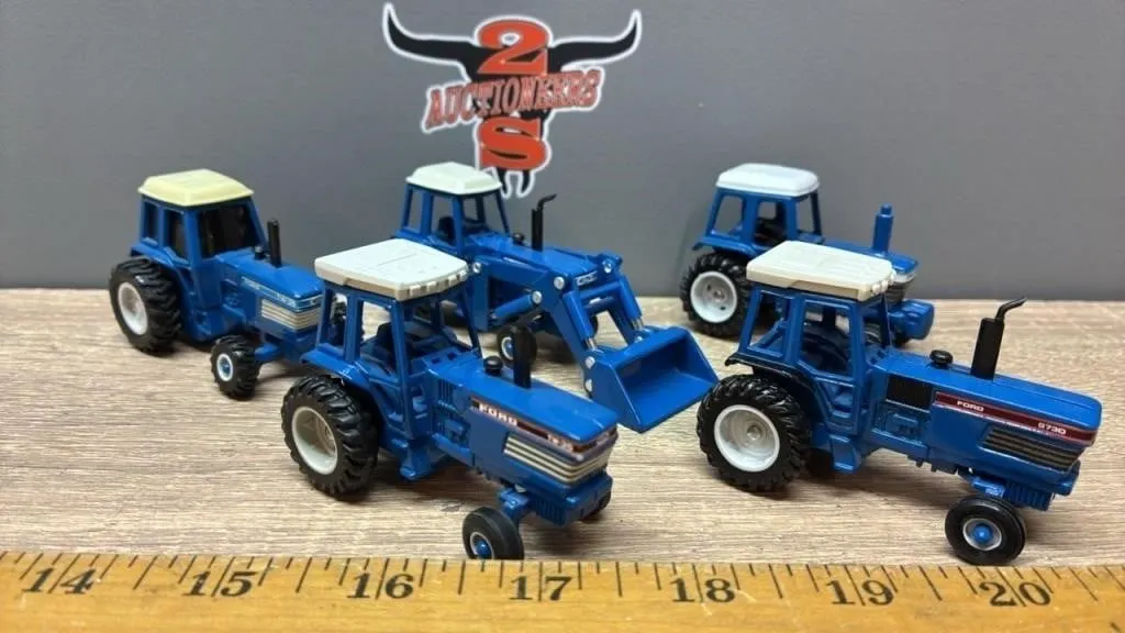 5, 1:64 Ford Tractors.