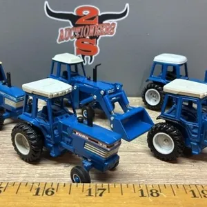 5, 1:64 Ford Tractors.