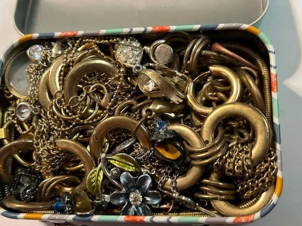 Vintage tin full of jewellery
