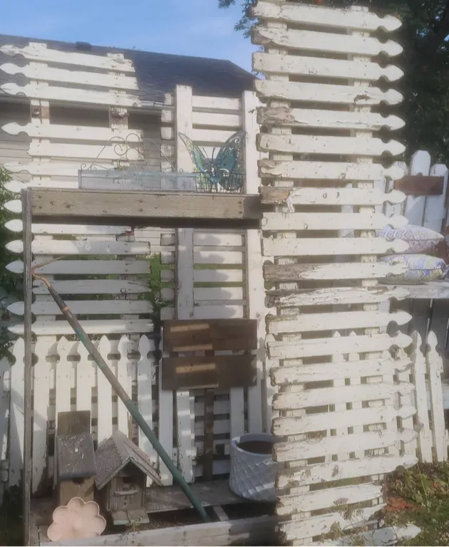 Rustic Garden Decor With Fencing, Birdhouses, Planters and Accents