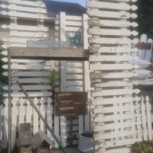 Rustic Garden Decor With Fencing, Birdhouses, Planters and Accents