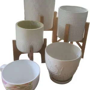 5 Ceramic Planters with Wooden Stands and Decorative Teacup Pot
