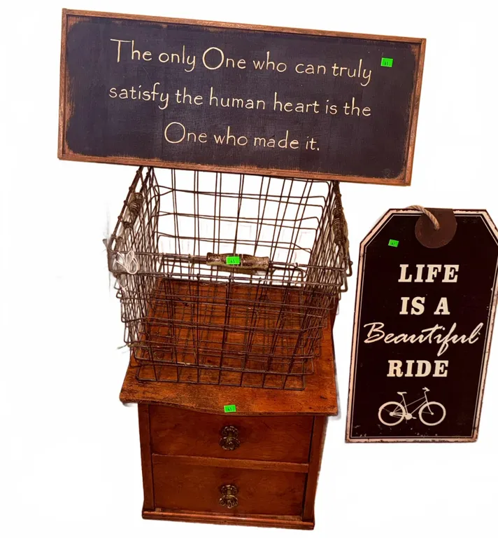 Decorative Signs, Wire Basket, and Two-Drawer Wooden Side Table