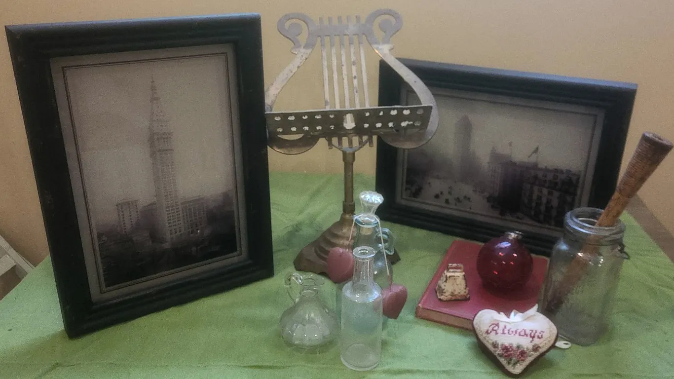 Decor Lot: Framed Photos, Metal Music Stand, Glass Bottles, Book, Jar