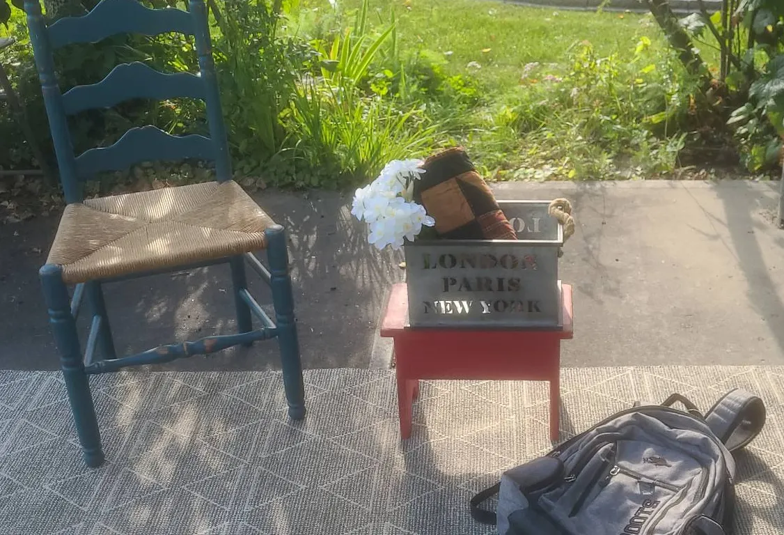 Household Items with Antique Hummingbird Feeder and Roots Backpack