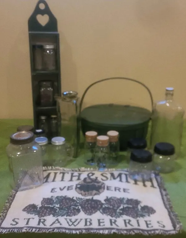 Lot with Assorted Glass Jars, Wooden Rack, Painted Basket, and Decor