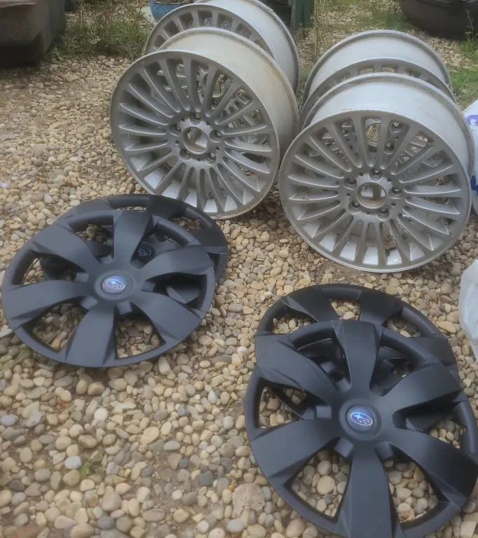 Four 15-Inch Alloy Wheels and Four Subaru Hubcaps