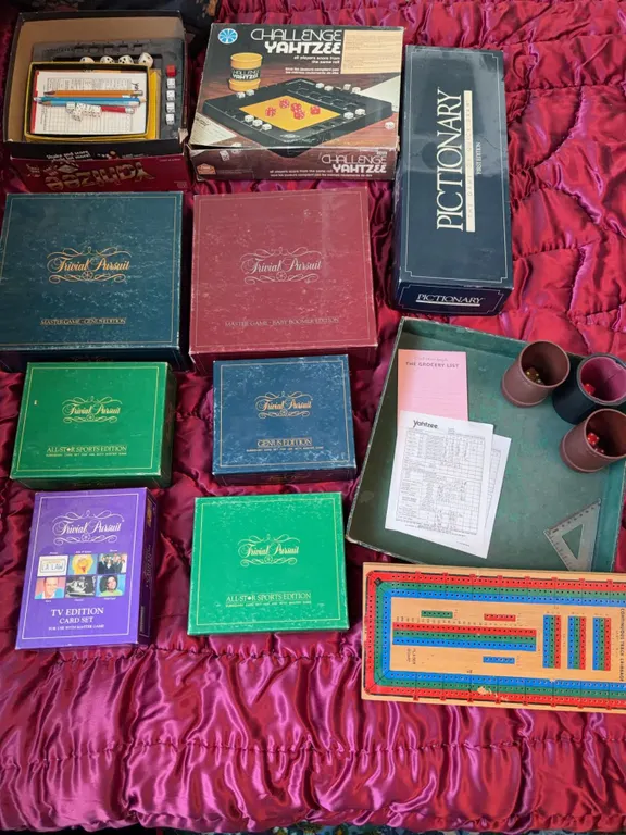 Vintage Board Games Including Trivial Pursuit, Yahtzee, and Pictionary