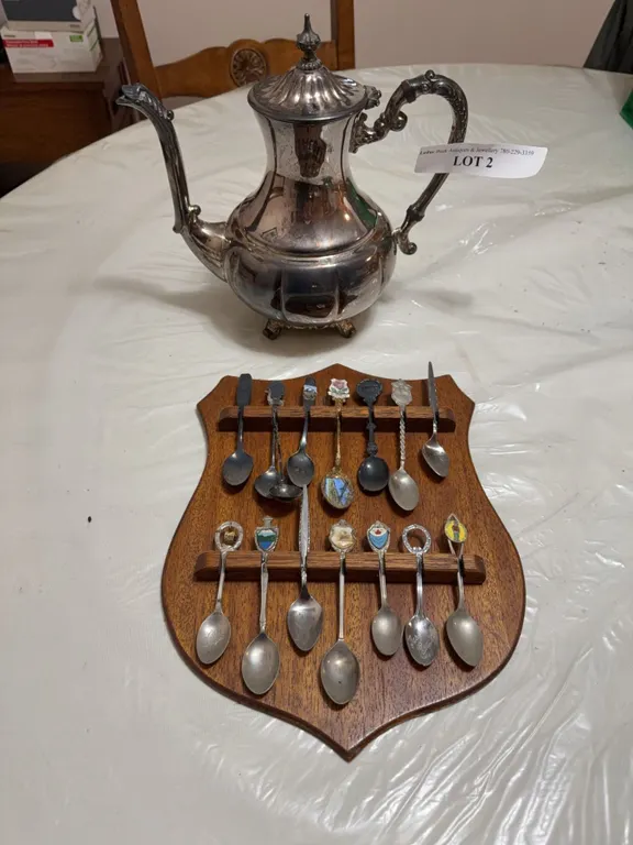 Silver-Plated Teapot and Collector Spoons on Plaque