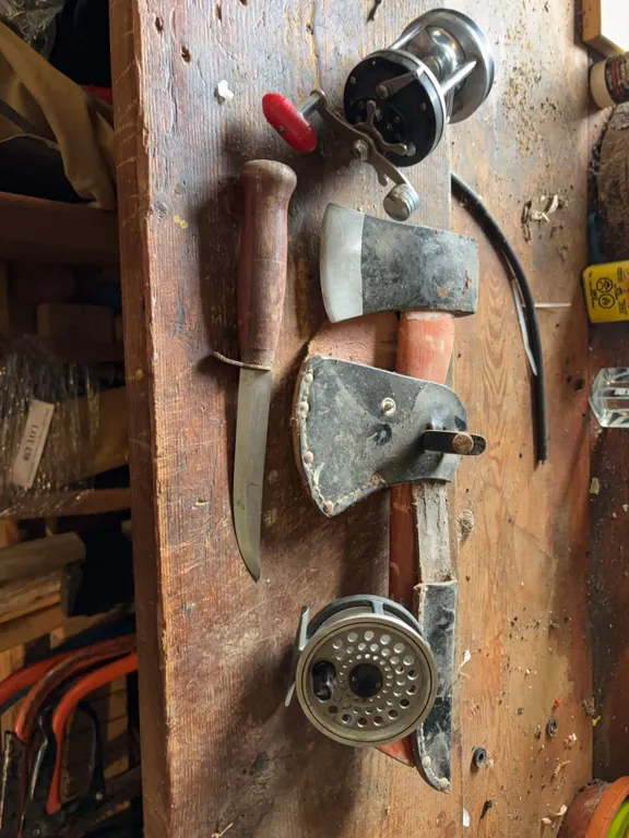 Fishing Reels, Knife, and Hatchet Tools Lot