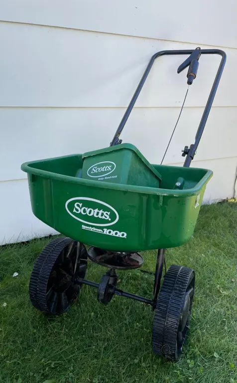 Lawn fertilizer and grass seeder. (GST 5 % charged)
