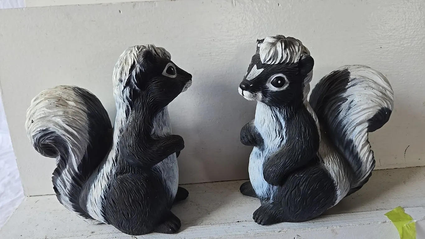 2 - Skunk Garden Ornaments