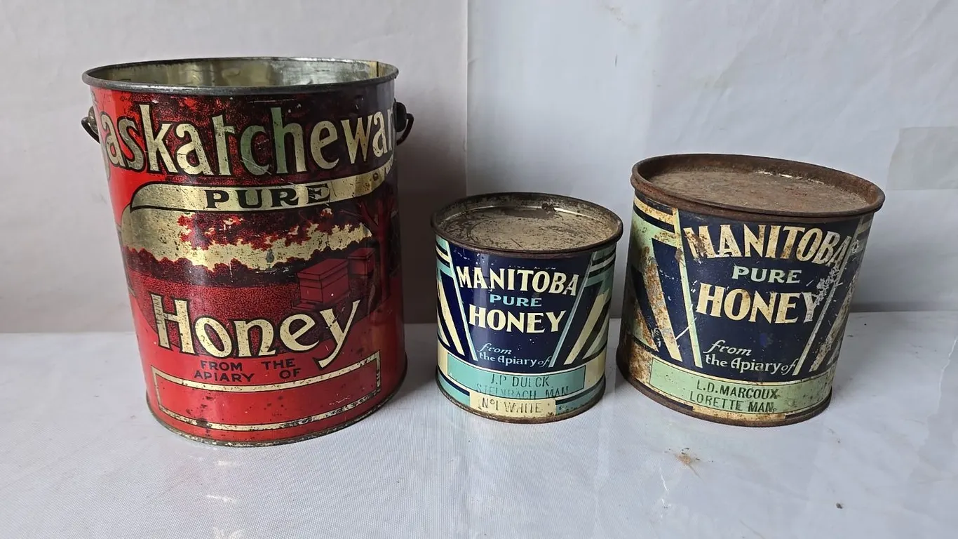 3 - Honey Tins; MB Honey 2lb. 3oz, Sask Pure 10lb. & MB Honey 4lb.